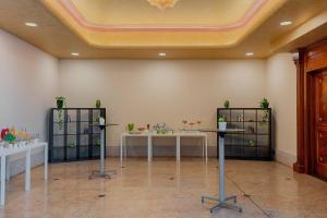 a room with two tables with plants on them at Rome Marriott Park Hotel in Rome