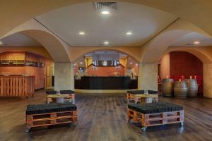 a room with three stools in a room with barrels at Rome Marriott Park Hotel in Rome
