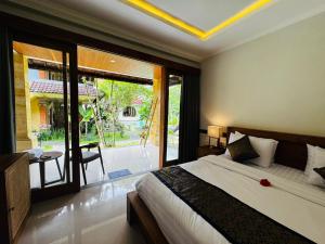 Postel nebo postele na pokoji v ubytování Ubud Kerta Prashati + 14 fotografií