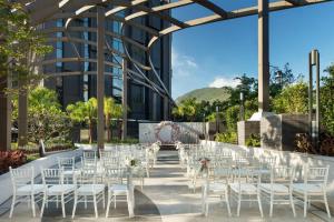 a set up for a wedding ceremony in front of a building at Hong Kong Ocean Park Marriott Hotel in Hong Kong