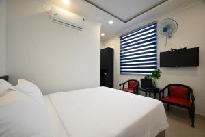 Ένα ή περισσότερα κρεβάτια σε δωμάτιο στο Hotel Trung Mai-Tân Bình +28 φωτογραφίες