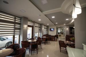 TV a/nebo společenská místnost v ubytování Hotel Olympos