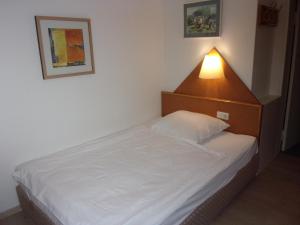 Postel nebo postele na pokoji v ubytování Hotel Fährhaus