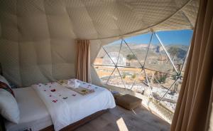 Postel nebo postele na pokoji v ubytování Jabal shams domes
