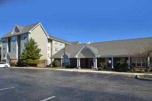 a parking lot in front of a building at Residence Inn by Marriott Dayton Troy in Troy