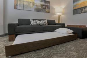 a large bed in a living room with a couch at SpringHill Suites by Marriott Yuma in Yuma +15 photos