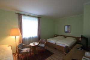 Postel nebo postele na pokoji v ubytování Hotel Bürgerhof