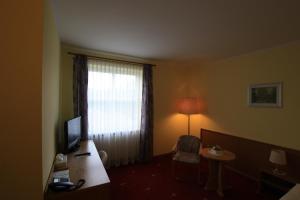 TV a/nebo společenská místnost v ubytování Hotel Bürgerhof