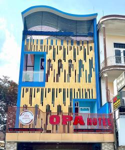 a building with a sign that reads a hotel at OPA HOTEL HUE in Hue +16 photos