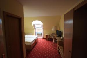 Postel nebo postele na pokoji v ubytování Hotel Bürgerhof