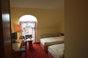 Postel nebo postele na pokoji v ubytování Hotel Bürgerhof