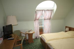 Postel nebo postele na pokoji v ubytování Hotel Bürgerhof