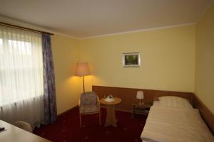 Postel nebo postele na pokoji v ubytování Hotel Bürgerhof
