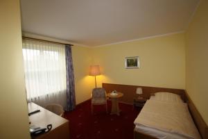 Postel nebo postele na pokoji v ubytování Hotel Bürgerhof