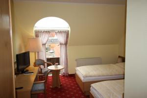 Postel nebo postele na pokoji v ubytování Hotel Bürgerhof