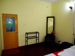 Letto o letti in una camera di Sigiri Sithru Home Stay