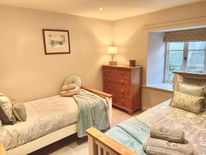 Ένα ή περισσότερα κρεβάτια σε δωμάτιο στο River Dance Cottage, Aysgarth