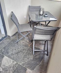 a table and two chairs and a table and a table at SofiYanis in Sibiu