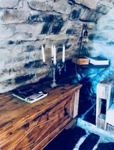 a room with a table with candles on it at La Ca' nel Borgo in Moltrasio +18 photos