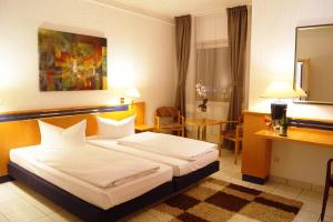 Postel nebo postele na pokoji v ubytování Hotel Rahlstedter Hof