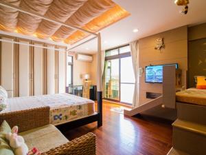 Postel nebo postele na pokoji v ubytování 宜人生活溜滑梯親子民宿 Easylife B&B