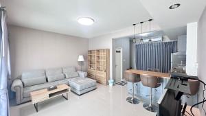 a living room with a couch and a table at Indy2 Bangna km7 By koii in Bang Kew Yai