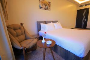 Postel nebo postele na pokoji v ubytování Blue Lotus Nile Suites Hotel Aswan