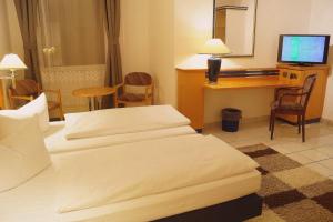 Postel nebo postele na pokoji v ubytování Hotel Rahlstedter Hof
