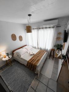 a bedroom with a bed and a television in it at Pousada Surf na Guarda in Guarda do Embaú