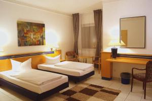 Postel nebo postele na pokoji v ubytování Hotel Rahlstedter Hof