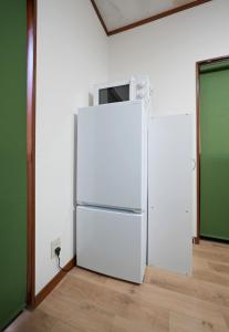 Kuchyň nebo kuchyňský kout v ubytování Cocomiya