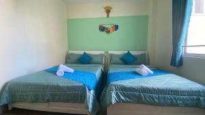 Postel nebo postele na pokoji v ubytování HUY HOANG II Hotel - Da Lat