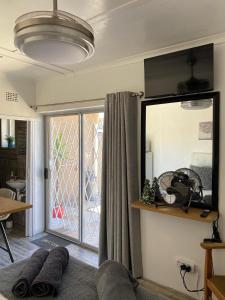 a living room with a couch and a window at Little Miracle in Beaufort West