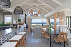 a kitchen and living room with a table and chairs at Sunset Villa in Scarborough