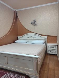 Ένα ή περισσότερα κρεβάτια σε δωμάτιο στο Comfortable Apartment +16 φωτογραφίες