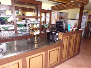 a bar in a restaurant with a counter top at Motel Oseček in Oseček