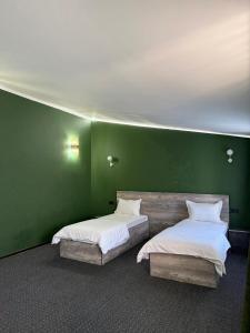 Ένα ή περισσότερα κρεβάτια σε δωμάτιο στο Shygys_hotel