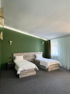 Ένα ή περισσότερα κρεβάτια σε δωμάτιο στο Shygys_hotel