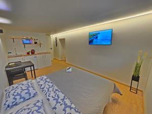 Ένα ή περισσότερα κρεβάτια σε δωμάτιο στο T7 Studio apartment