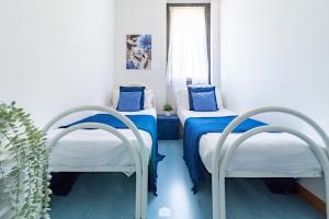 Postel nebo postele na pokoji v ubytování Blu Al Lago - Lago di Como