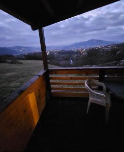 a chair sitting on a balcony with a view at blanca 6 in Nova Bila