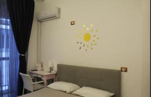 Postel nebo postele na pokoji v ubytování KiMia Home, Centro