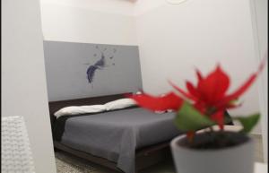 Postel nebo postele na pokoji v ubytování KiMia Home, Centro