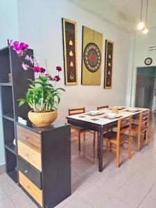 a dining room with a table and chairs at house 1 for 6 paxs whole house 3 beds in Hat Yai