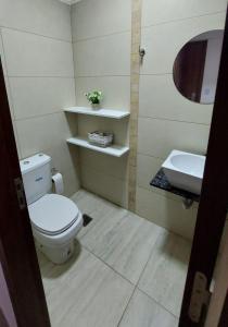 a bathroom with a toilet and a sink at Tango 4C in Victoria +11 photos