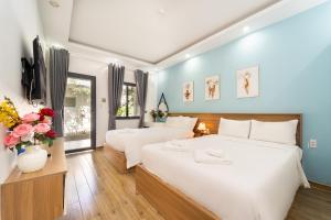 Кровать или кровати в номере Rum Resort Phu Quoc