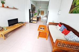 a living room with a couch and a table at house 1 for 6 paxs whole house 3 beds in Hat Yai