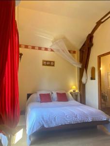 Postel nebo postele na pokoji v ubytování Maison d'Hotes Le Chai d'Armagnac