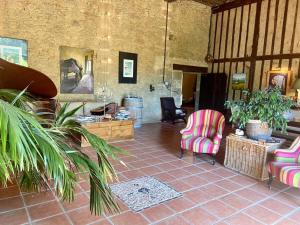 Posezení v ubytování Maison d'Hotes Le Chai d'Armagnac