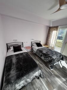 A bed or beds in a room at Queen of Orliaka